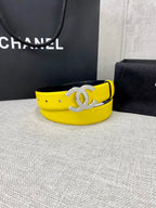 Chanel belt with bright yellow strap and large gold-tone CC clasp, angled