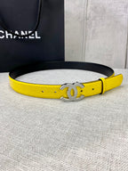 Chanel belt in bright yellow leather with gold CC logo buckle, laid flat