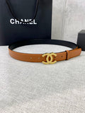 Tan leather belt with gold-tone CC buckle and punched holes.