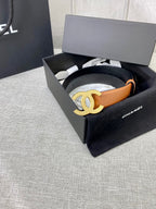 Tan leather belt with gold-tone CC buckle, in a black gift box.