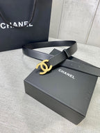 Chanel belt with gold-tone CC buckle on black leather strap, on box