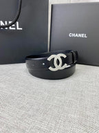 Chanel belt with black leather strap and silver-tone CC logo buckle