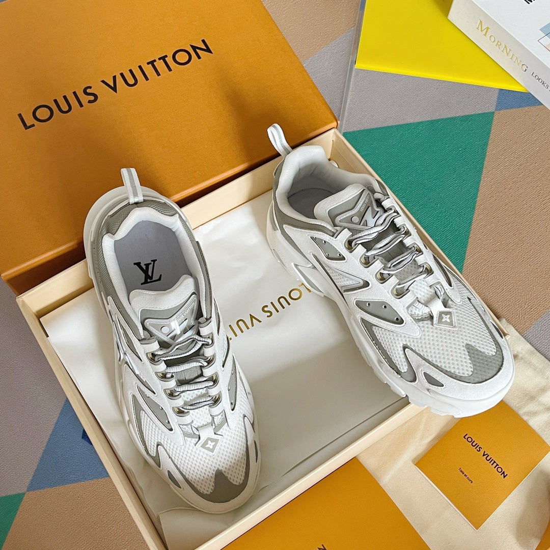 White and gray lace-up sneakers with textured panels and chunky tread sole