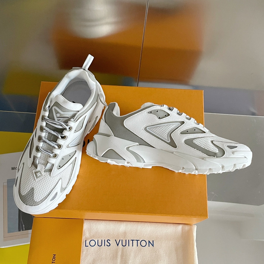 Pair of white and gray chunky sneakers with lace-up closure and cushioned tongue