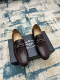 Prada unisex leather loafers with metal buckle strap, dark brown, side-by-side view
