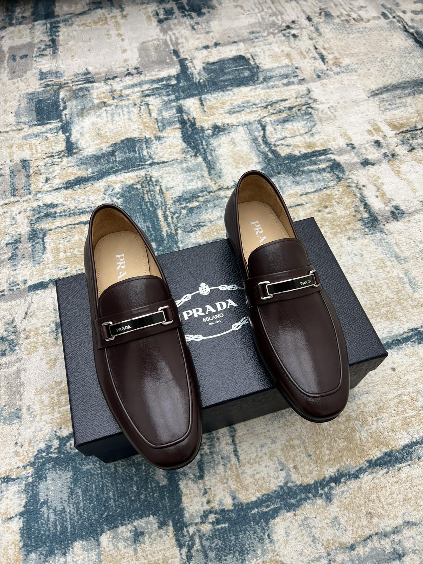 Prada unisex leather loafers with metal buckle strap, dark brown, side-by-side view