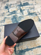 Prada brown leather loafer sole and side profile, low block heel