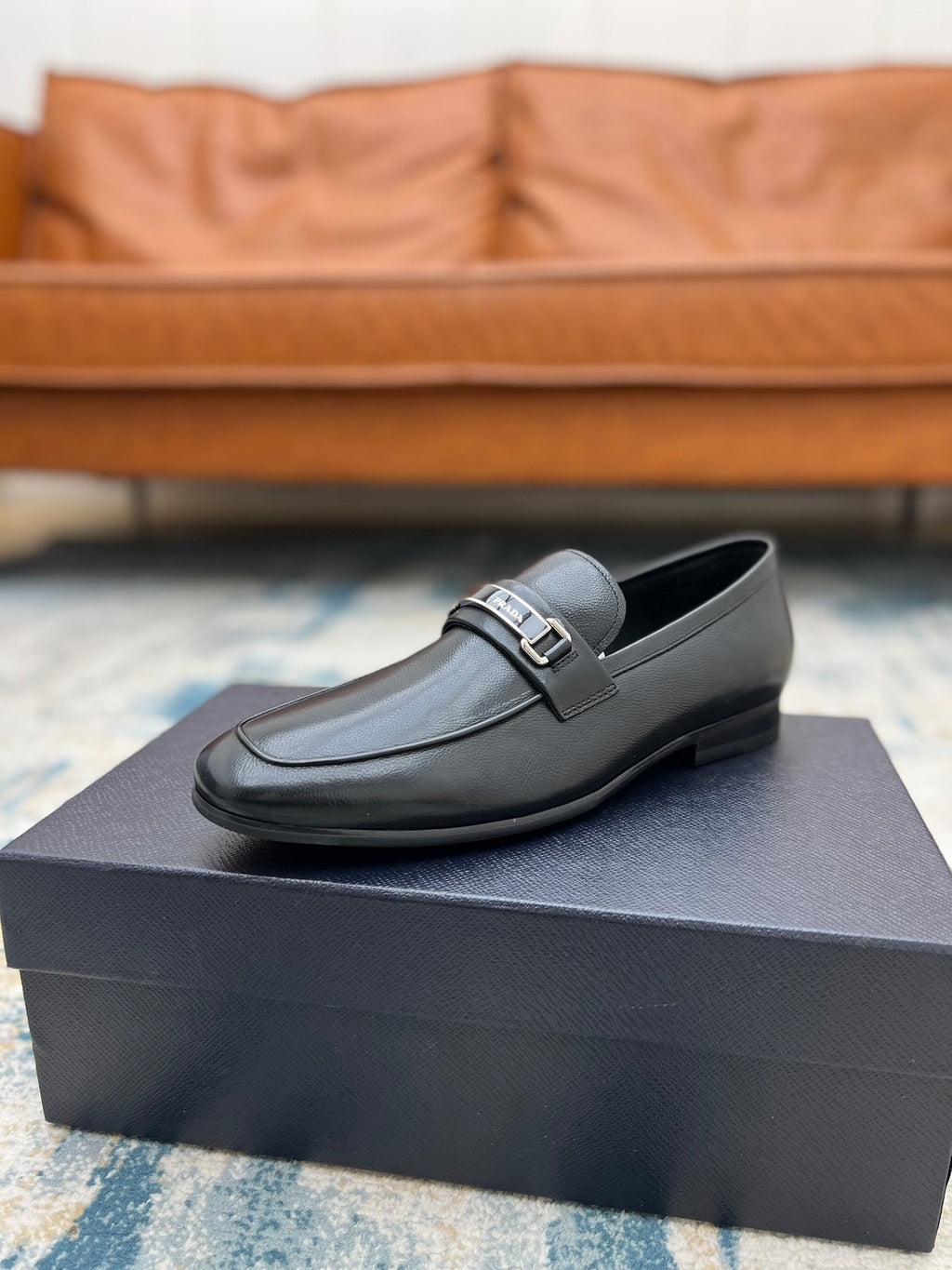 Prada unisex loafers, black leather with silver buckle strap and low block heel.