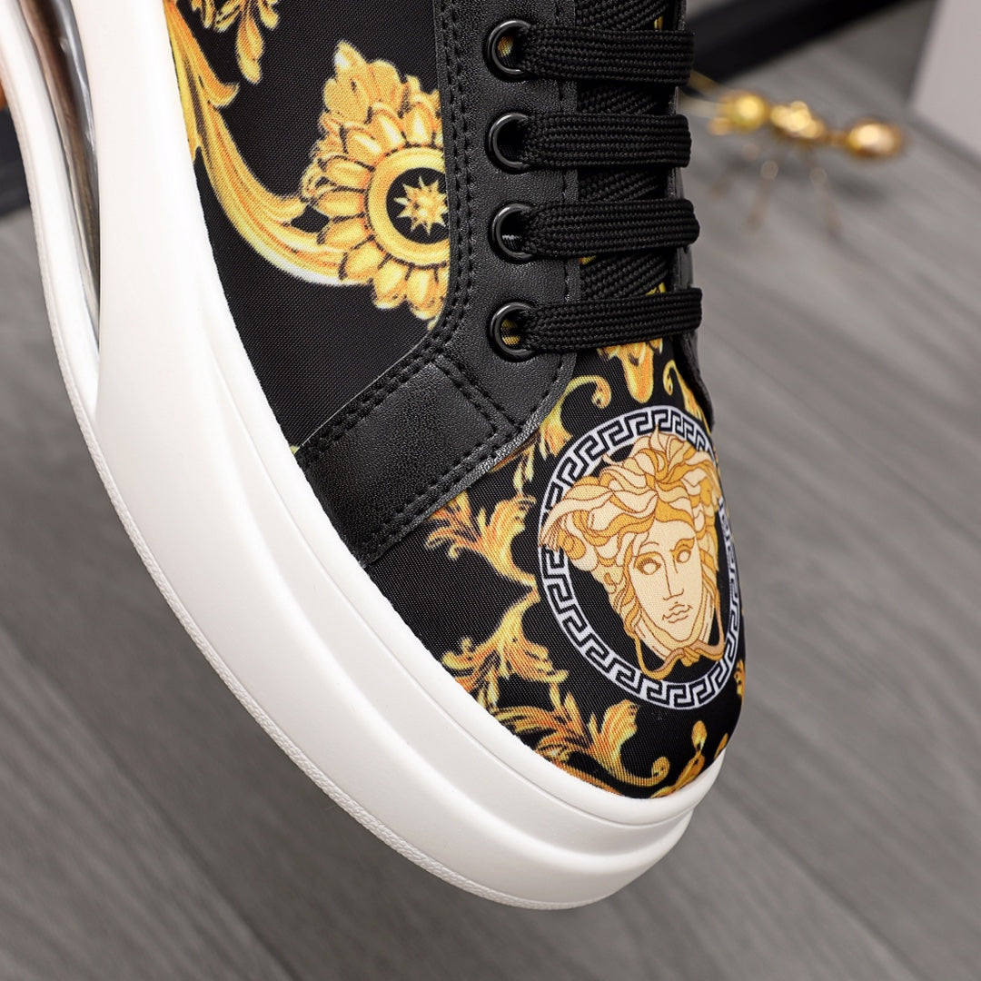 Sneaker upper in black with gold floral and Medusa-style emblem, black lace-up.