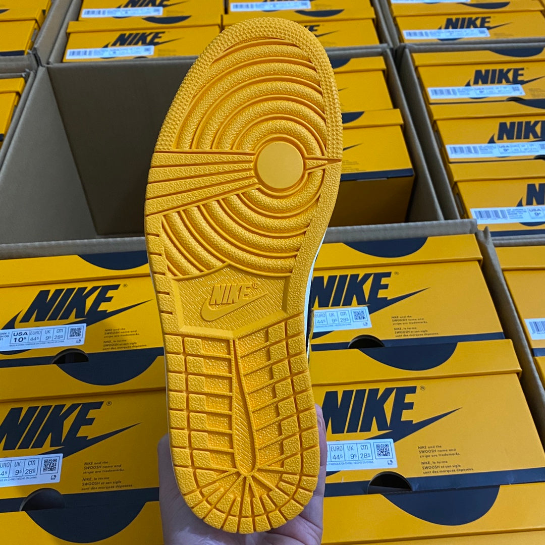 High-top sneaker outsole tread in yellow with raised logo and grid pattern
