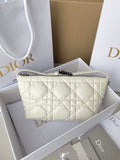 White quilted mini shoulder bag with top zip and leather handles.