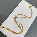 Dior gold-tone charm bracelet with star and oval letter charms