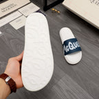 White rubber slide sandal sole with embossed pattern, navy-banded mate