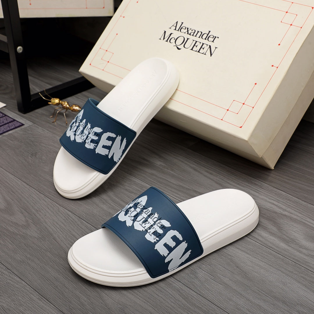 White slide sandal with navy strap and white graphic lettering