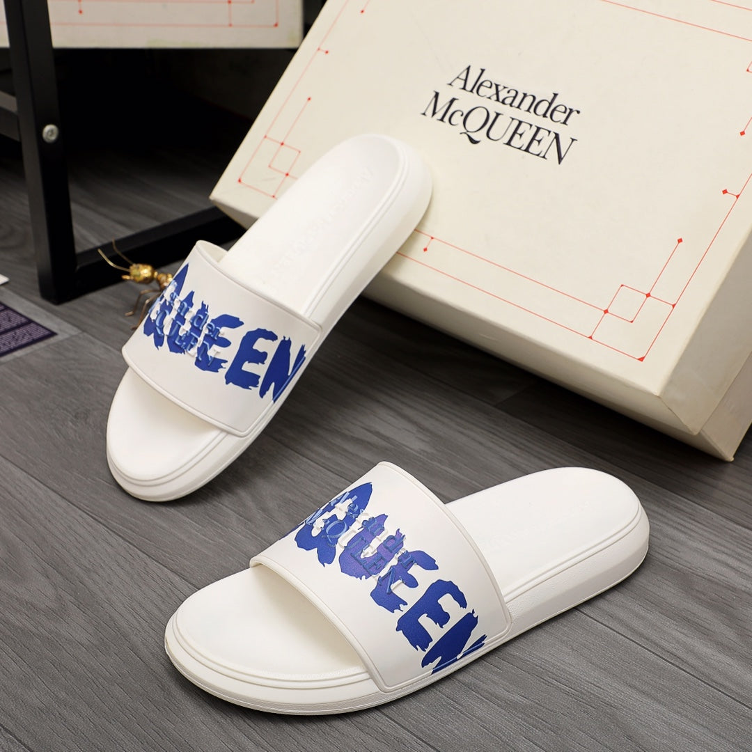 Alexander McQueen white slide sandals with blue logo strap