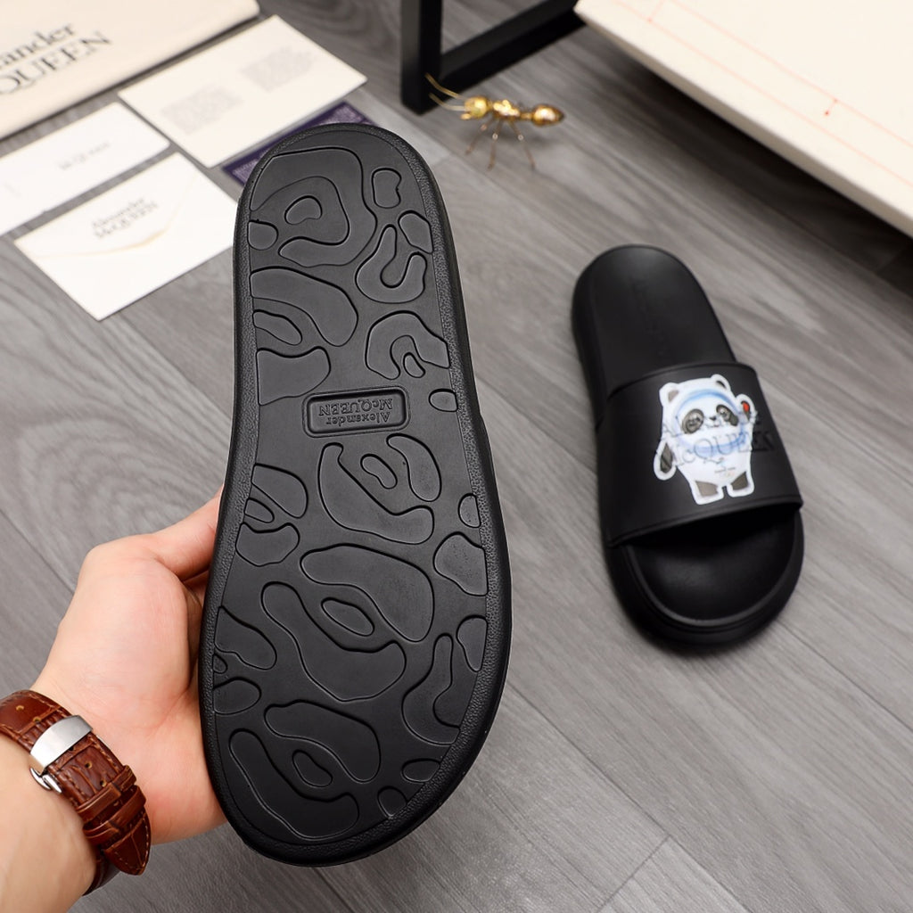 Black slide sandal outsole with molded tread pattern