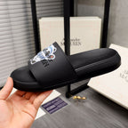 Black slide sandals with front strap featuring panda graphic