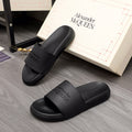 Black slide sandals with wide strap and Alexander McQUEEN logo, open toe