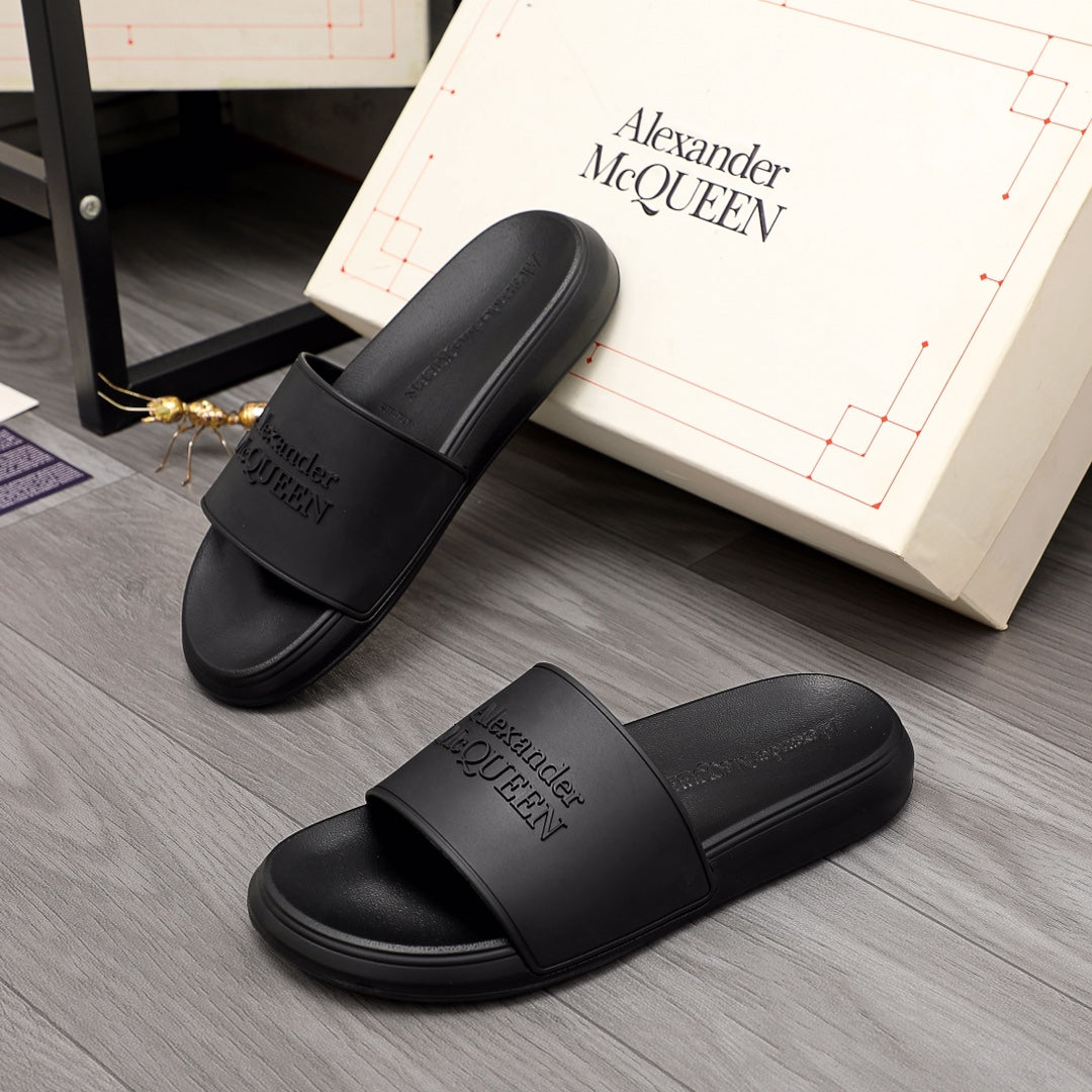 Black slide sandals with wide strap and Alexander McQUEEN logo, open toe
