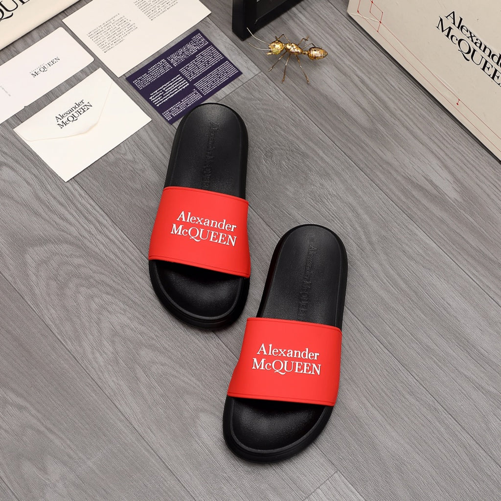 Pair of black slide sandals with red Alexander McQUEEN logo straps