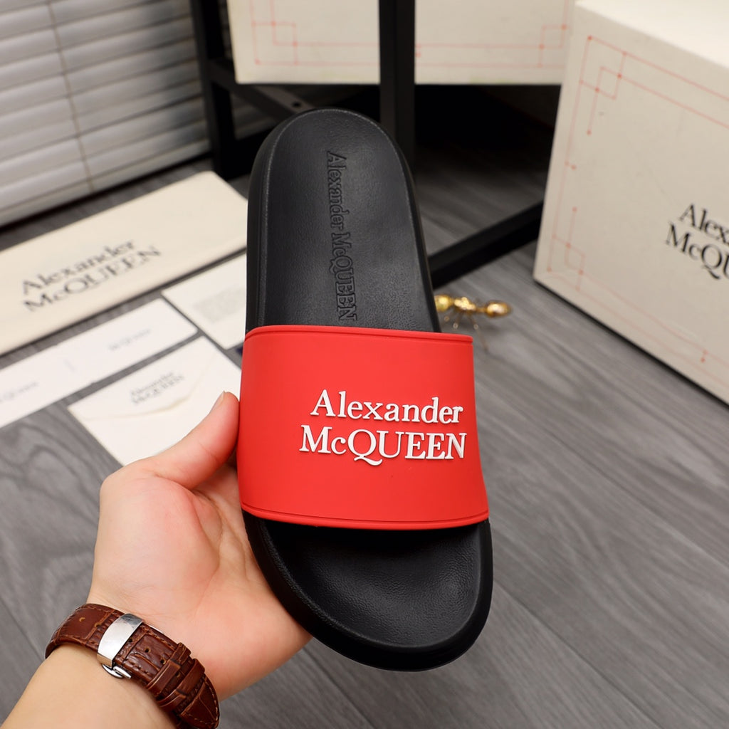 Black slide sandal with red Alexander McQUEEN band and contoured footbed