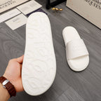 White slide sandal outsole with textured traction pattern