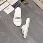 White slide sandal pair, Alexander McQUEEN logo on strap and side
