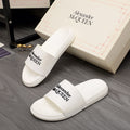 White slide sandal with wide logo strap, Alexander McQUEEN branding