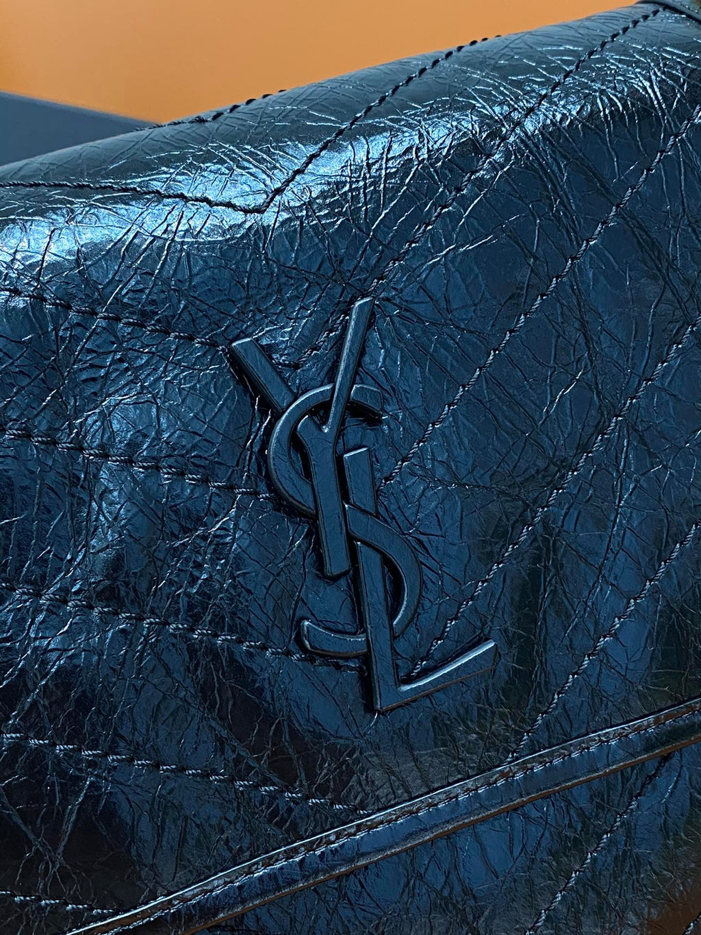 YSL Saint Laurent quilted flap, dark blue leather with embossed YSL logo