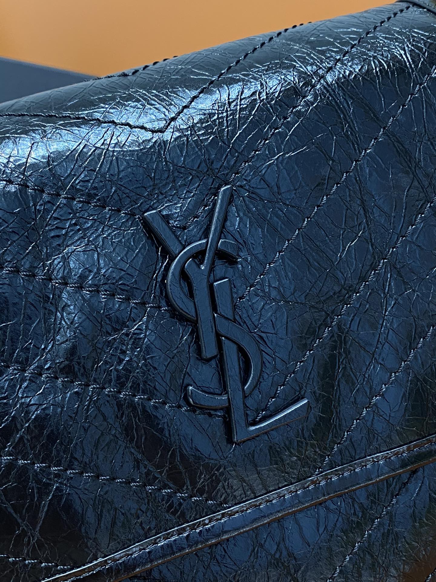 YSL Saint Laurent quilted flap, dark blue leather with embossed YSL logo
