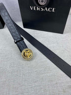 Black embossed leather belt with gold Versace medallion buckle and multiple holes