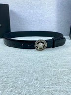 Black embossed leather belt with round Versace medallion buckle and adjustable holes