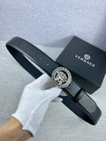 Black leather Versace belt with gold Medusa medallion buckle and perforated strap holes.