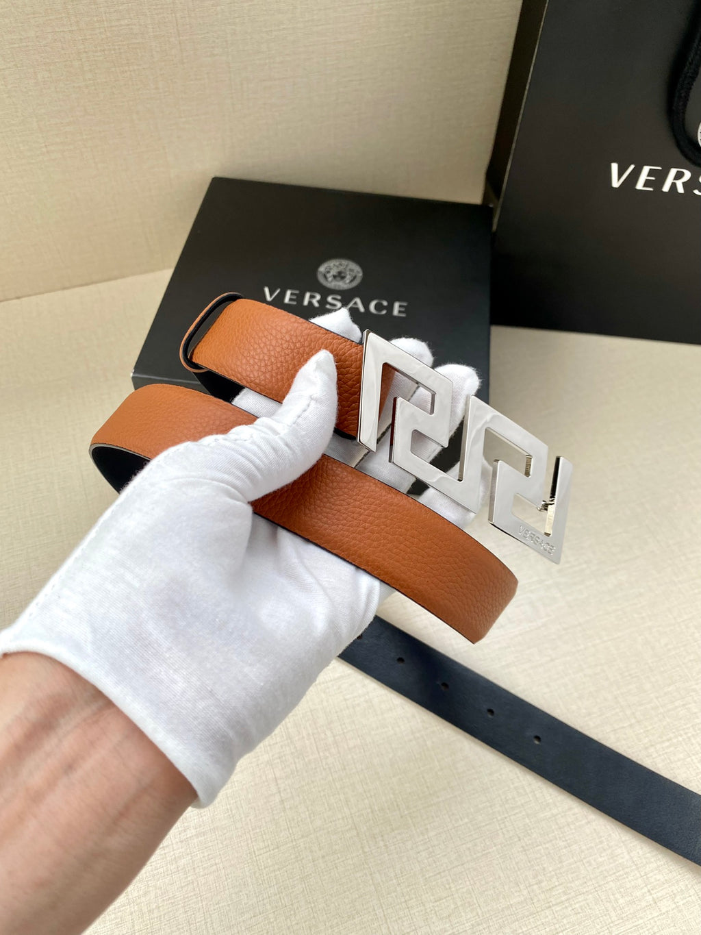 Versace belt with tan leather strap and gold logo buckle