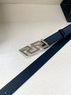Dark blue leather belt with silver-tone rectangular buckle plate