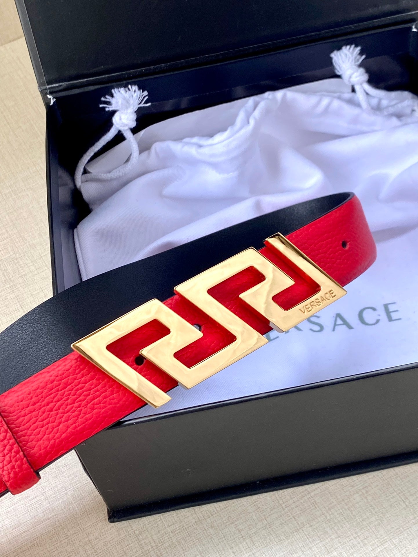 Versace red belt in a gift box with gold-tone FF buckle