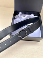 Black leather belt with silver-toned ornate buckle and stitched holes