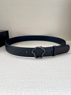 Black leather belt with dark ornate buckle and decorative frame