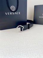 Navy leather belt with silver-tone Medusa-shaped buckle and stitched edges