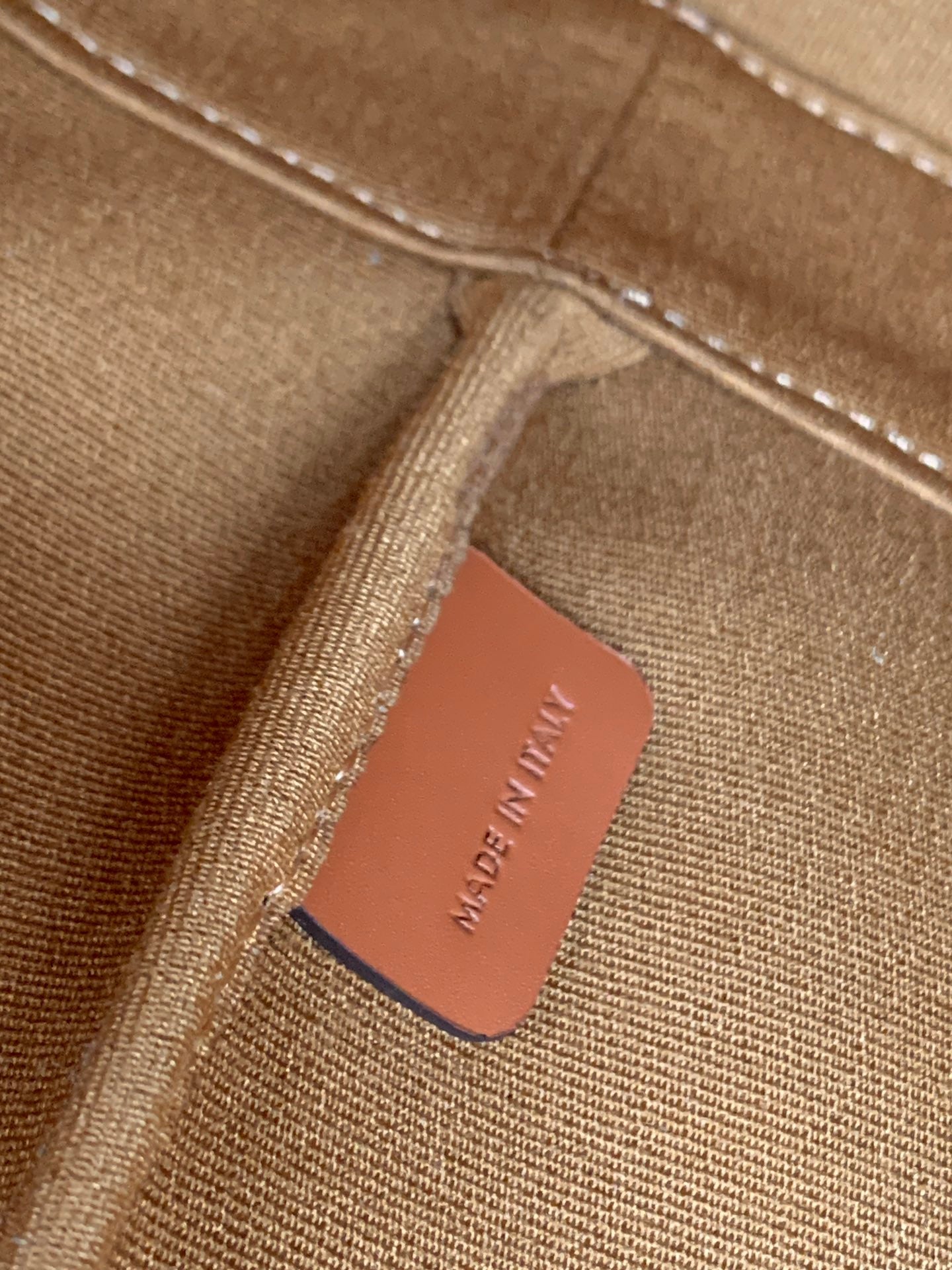 Celine bag fabric label inside seam reading 'MADE IN ITALY'