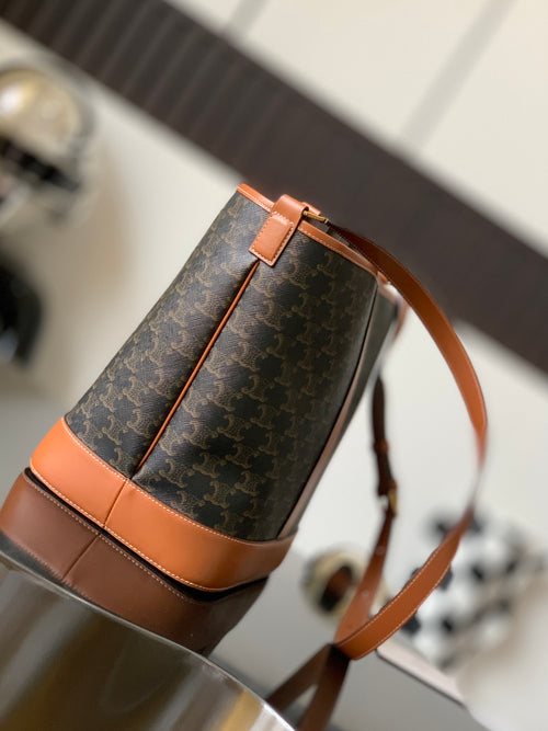 Celine bag in dark monogram canvas with tan leather crossbody strap and zip top