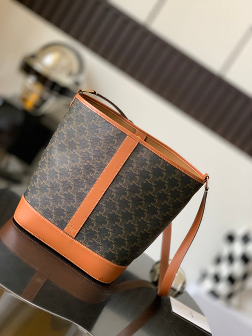 Celine bag in dark monogram canvas with tan leather handles and zip top