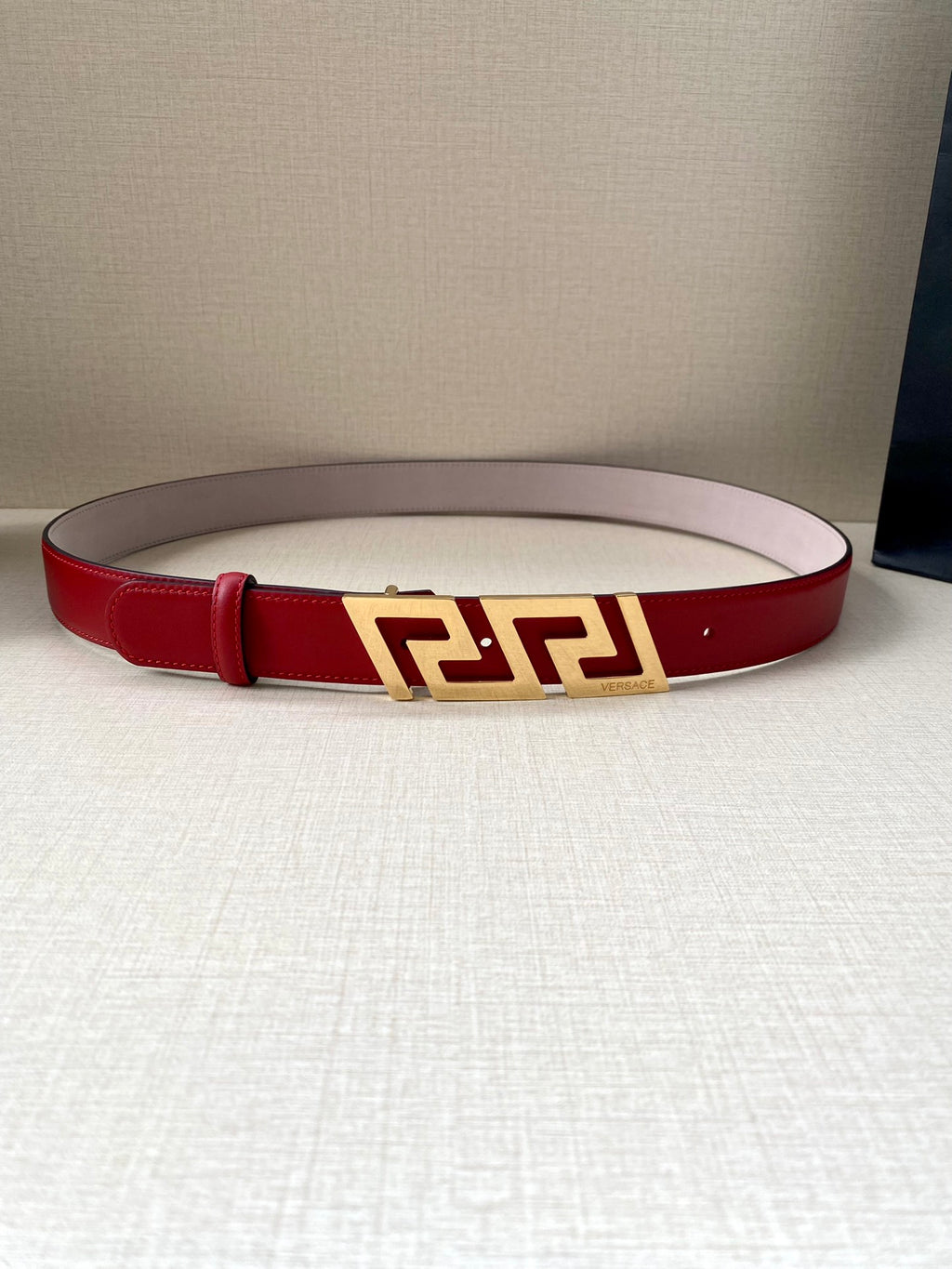 Versace belt in red leather with gold Greek-key buckle and center fastening holes