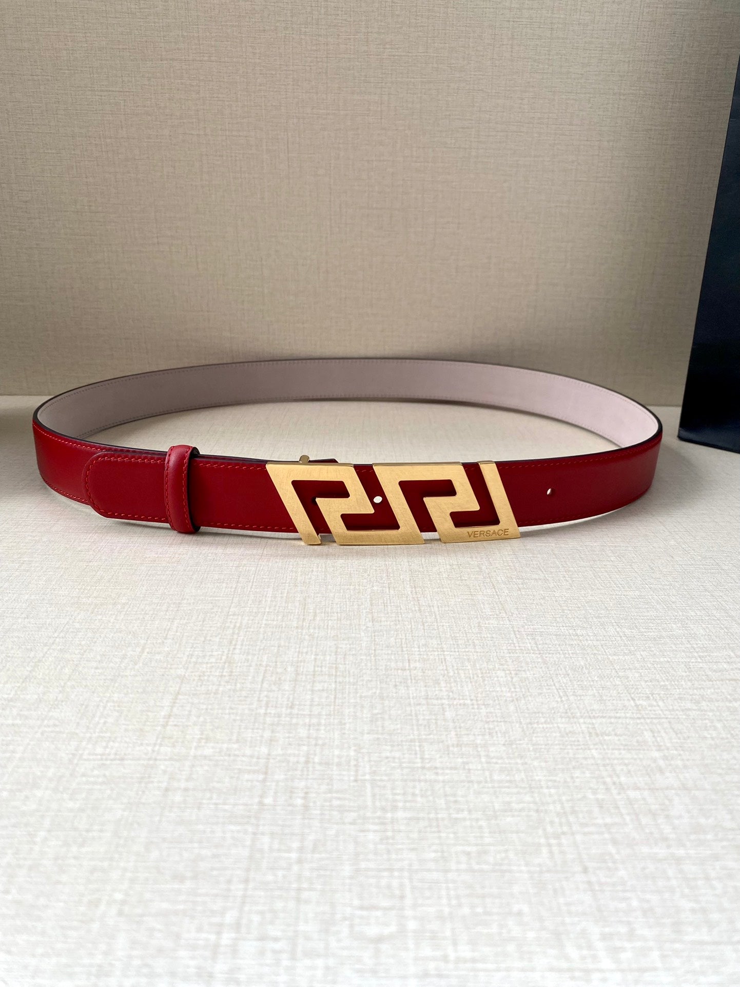 Versace belt in red leather with gold Greek-key buckle and center fastening holes