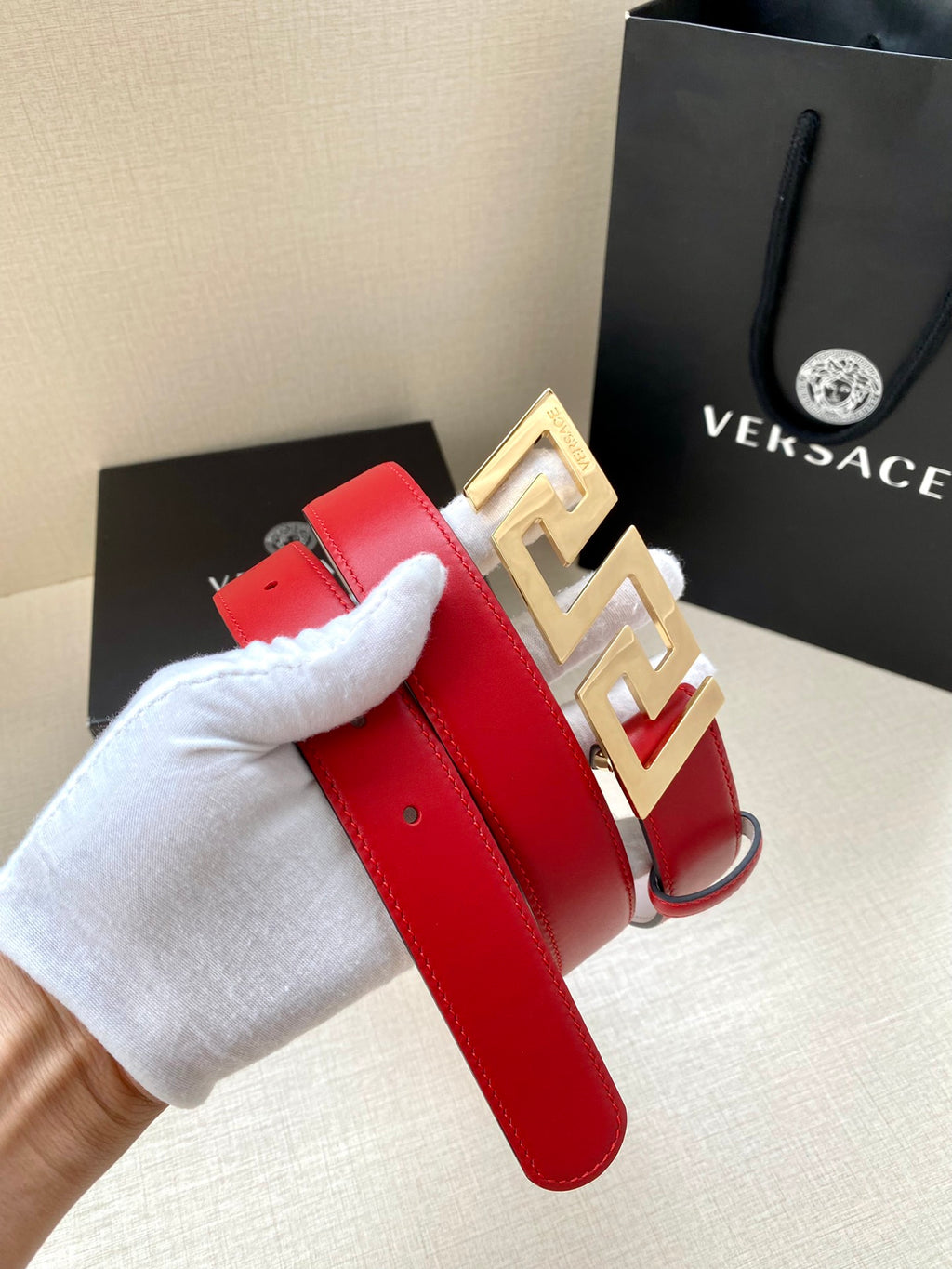 Versace belt in red leather with gold Greek-key buckle and prong holes