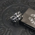 Filigree flower ring with round center bead, silver-tone metal.