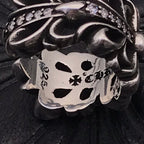 Engraved inner ring band with numbers and floral marks, silver-tone.