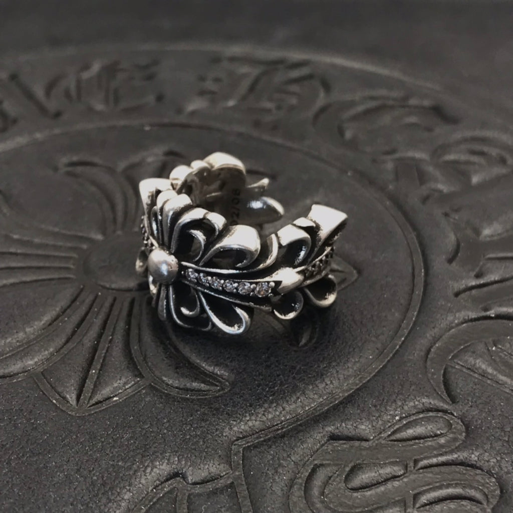 Layered petal filigree ring with pearl-like beads, silver-tone.