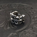 Layered petal filigree ring with pearl-like beads, silver-tone.