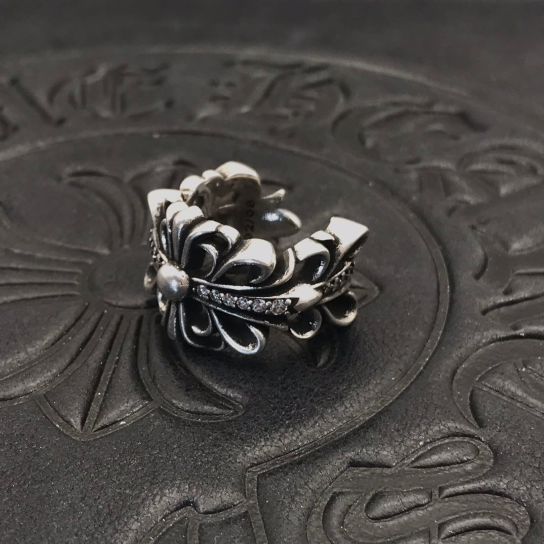 Layered petal filigree ring with pearl-like beads, silver-tone.